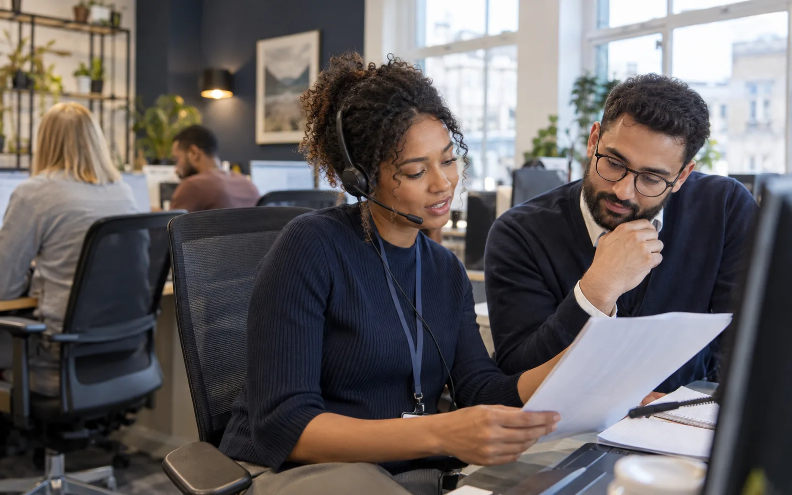 Office colleagues coordinating a customer request