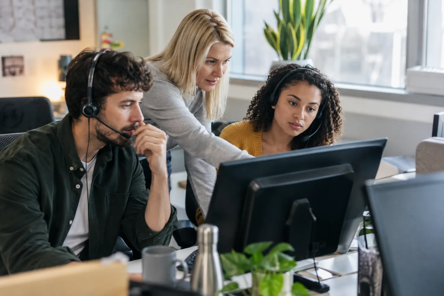 Customer support colleagues working through a request together